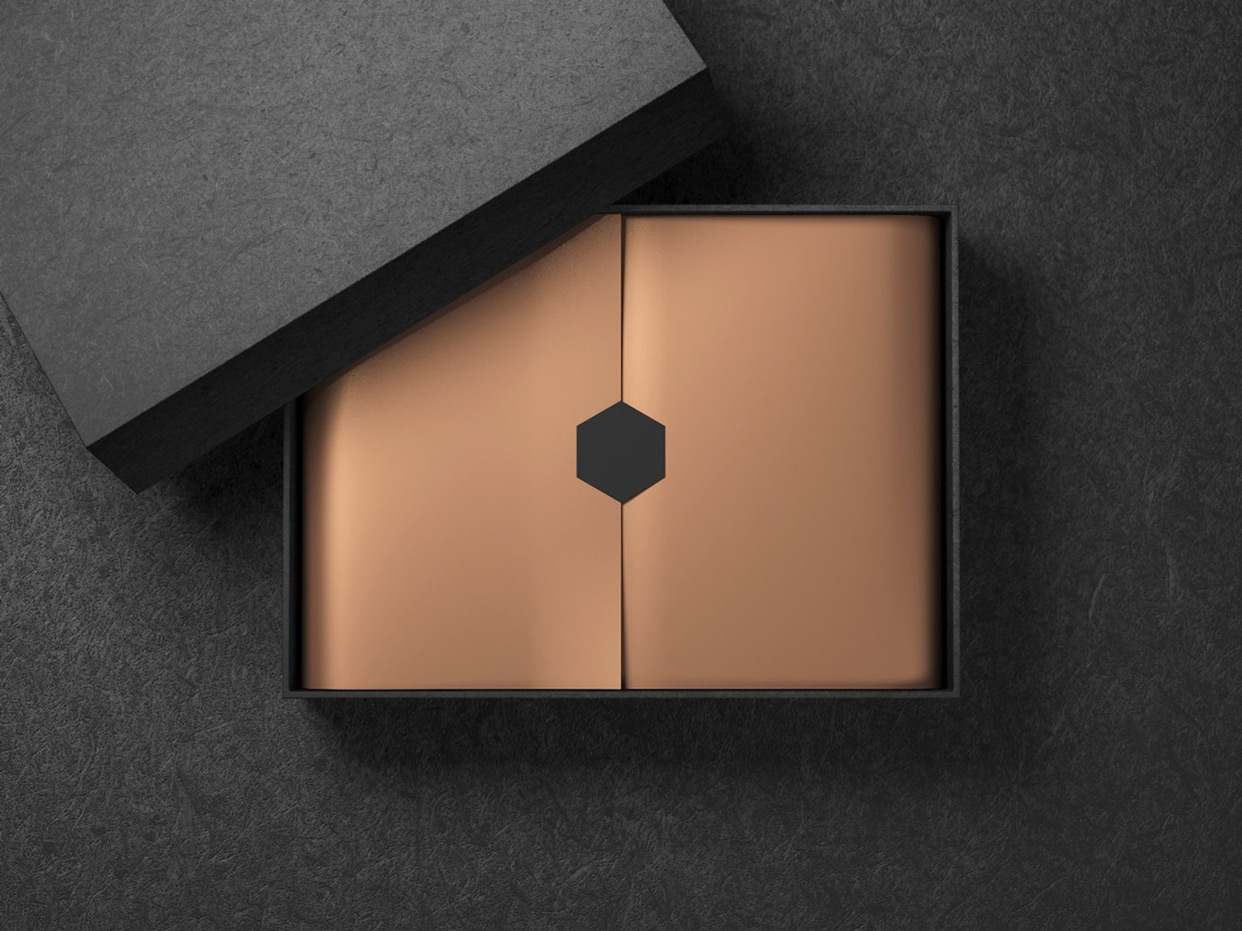 Bronze Designed Packaging with Black Hexagonal Seal on Dark Grey Background