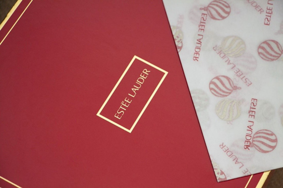 Estee Lauder Red Packaging with Gold Logo