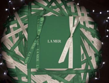 La Mer Green Packaging with Green and White Ribbons