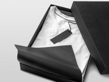Black Boxed Packaging with White T-Shirt Inside with Black Tag